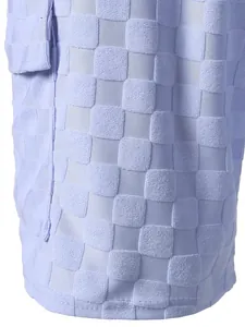 Macro detail of the lavender checkered jacquard fabric on men's casual summer shorts