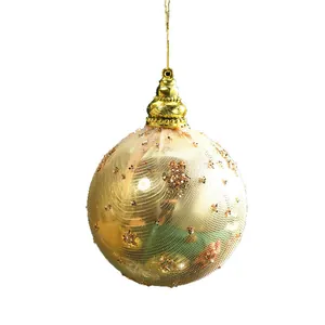 Elegant champagne gold Christmas tree ornament ball with mesh wrap and glitter dots