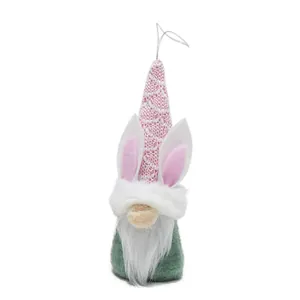 Detailed shot of a cute Easter gnome ornament with pink ears and a knitted hat