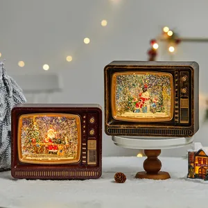 Retro TV Christmas snow globe with spinning glitter, light and music, festive ornament