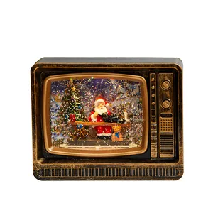 Vintage TV Christmas ornament with swirling snow glitter and festive Santa scene inside