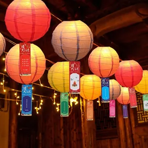 Colorful Chinese New Year paper lanterns with riddle cards for mall festive decoration