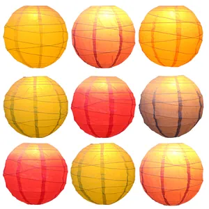 Assorted traditional round paper lanterns set in warm red and yellow for festive decor