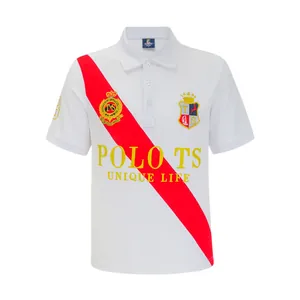 British style white polo shirt with red diagonal sash and embroidered crest detail.