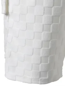 Macro view of white checkerboard jacquard fabric on men's casual summer shorts