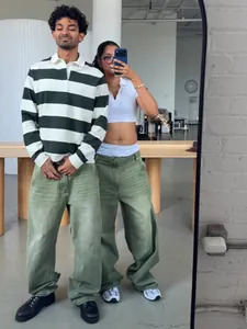 Stylish matcha green wide-leg denim pants with a loose fit and washed gradient finish.