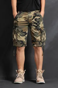 Detailed view of men's camouflage cargo shorts with multiple tactical side pockets