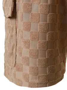 Detailed close-up showing the checkered jacquard texture of men's summer holiday shorts.