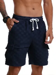 Close-up of men's navy checkered cargo shorts with drawstring and side pockets