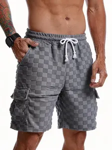 Close-up of men's grey checkered jacquard shorts showing 3D texture and drawstring.