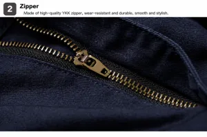 Detailed view of high-quality metal zipper on navy blue durable cargo pants
