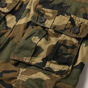 Close-up detail of durable multi-pocket camouflage cargo pants for outdoor hiking activities