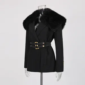 Detailed view of black tailored blazer featuring a luxurious detachable faux fur collar.