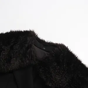 Macro view of plush detachable black faux fur collar on a tailored suit blazer jacket