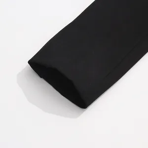 Macro view of the refined sleeve cuff detail on this black tailored slim-fit blazer