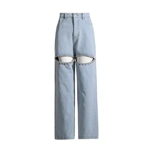 High-waisted light blue wide-leg jeans with rhinestone-trimmed hollow cutouts at knees