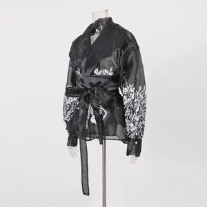 Elegant black sheer lantern sleeve blouse with intricate white floral embroidery