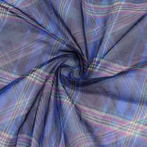 Close-up detail of blue plaid mesh fabric showing fine texture and breathable weave