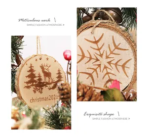 Detail view of rustic wood slice Christmas ornaments with engraved reindeer and snowflake patterns