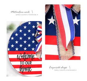 Detail view of American Independence Day wooden sign with burlap bow and patriotic stripes