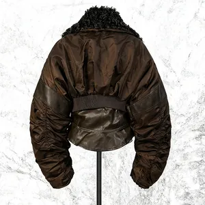 Detail view of vintage brown cropped jacket with pleated sleeves and fur collar.