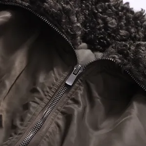 Close-up detail of retro cropped jacket with plush sherpa collar and smooth zipper