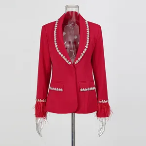 Detailed view of elegant red women blazer featuring rhinestone trim and red ostrich feather cuffs