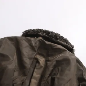 Detailed view of faux fur collar and textured fabric on American vintage style jacket