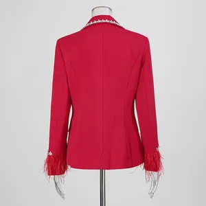 Detailed back view of an elegant red blazer with feather cuffs and diamond trim collar.