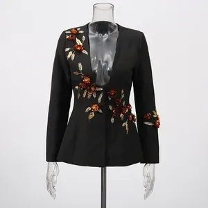 Elegant black blazer jacket with 3D floral applique and gold embroidery on mannequin