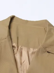 Detailed close-up showing the lapel and smooth lining of an elegant khaki long trench coat