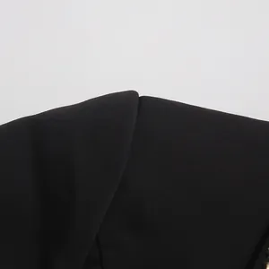 Detailed close-up of high-quality black fabric and seam on a French style blazer