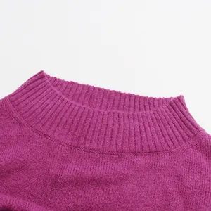 Detailed close-up of the ribbed mock neck on a purple French-style loose knitted sweater.