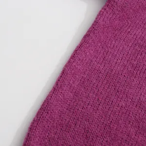 Close-up macro view of the soft purple knitted fabric texture showing fine weave details