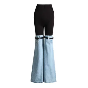 Vaqueros acampanados empalmados únicos con parte superior negra y parte inferior denim