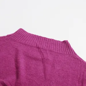 Detail view showing the ribbed neckline and texture of this purple knit sweater