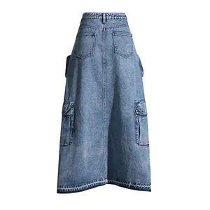 Back view of high-waist denim cargo skirt with large flap pockets and washed blue finish.
