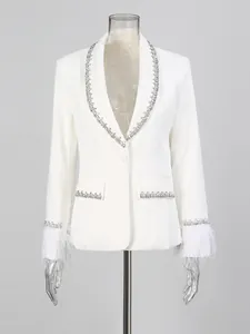 Elegant white blazer featuring rhinestone trim and luxurious feather cuffs design