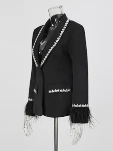 Elegant black slim-fit blazer with rhinestone trim and feather cuffs for women.