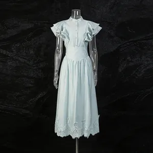 Light blue vintage two-piece set featuring ruffle sleeves and detailed lace hemline