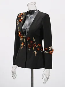 Elegant black women's designer blazer featuring heavy 3D gold floral appliqué details.