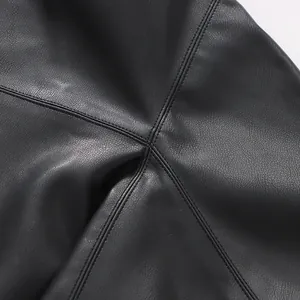 Close-up of high-quality black faux leather texture and stitching detail