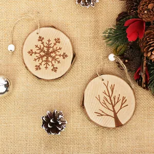 Natural wooden Christmas tree ornaments with engraved snowflake and tree designs