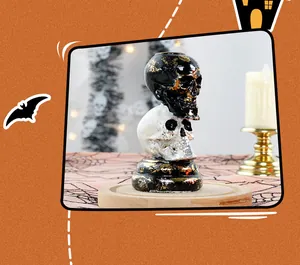 Detail view of a stacked black and white skull resin ornament for Halloween Gothic decor