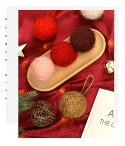 Cozy Christmas wool yarn ball ornaments displayed on a festive red velvet background
