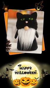 Close-up of a festive Halloween black cat gnome plush with white beard and pumpkins