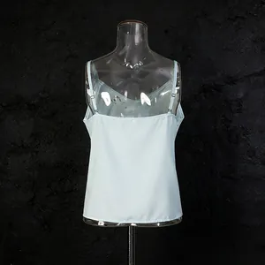Back view of a light blue silk camisole on a transparent mannequin