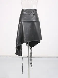 Elegant black asymmetric faux leather mini skirt featuring unique lace hem detailing