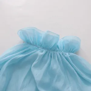 Detailed macro view showing the delicate light blue mesh fabric and elegant ruffled collar design