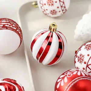 Set of 16 red and white Christmas ball ornaments with glitter snowflake patterns